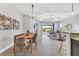 Dining area with open views of the living room at 21649 Avon Park Ct, Venice, FL 34293