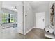 Open foyer with neutral tones leading to a bright office space at 21649 Avon Park Ct, Venice, FL 34293