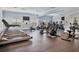 Modern fitness center with treadmills, elliptical machines, and stationary bicycles at 21649 Avon Park Ct, Venice, FL 34293