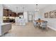 Gourmet kitchen features sleek countertops, stainless steel appliances, and a breakfast bar with seating at 21649 Avon Park Ct, Venice, FL 34293