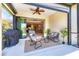 Comfortable lanai with nice seating and BBQ grill, offering an inviting spot for outdoor enjoyment at 21649 Avon Park Ct, Venice, FL 34293