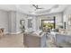 Stylish living room featuring neutral tones, tray ceilings, and abundant natural light at 21649 Avon Park Ct, Venice, FL 34293