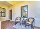 Inviting front patio with comfortable seating and stylish decor at 21649 Avon Park Ct, Venice, FL 34293