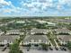 Aerial view of a community with well-maintained buildings, landscaping, and ample parking at 233 Cape Harbour Loop # 107, Bradenton, FL 34212