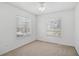Neutral bedroom offering natural light from two windows and carpeted floors at 233 Cape Harbour Loop # 107, Bradenton, FL 34212