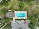 Aerial view of a refreshing community pool with lounge chairs and adjacent parking at 233 Cape Harbour Loop # 107, Bradenton, FL 34212