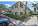 Inviting townhome showcasing manicured landscaping, large windows, and a well-lit walkway at 233 Cape Harbour Loop # 107, Bradenton, FL 34212