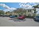 Well-maintained townhome with ample parking, mature trees, and manicured landscaping at 233 Cape Harbour Loop # 107, Bradenton, FL 34212