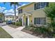 Charming townhome with a well-maintained front yard, inviting entrance, and dedicated parking at 233 Cape Harbour Loop # 107, Bradenton, FL 34212