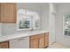 Spacious kitchen with white countertops and views to the dining room at 233 Cape Harbour Loop # 107, Bradenton, FL 34212