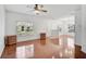 Bright living room with hardwood floors and large windows, creating a welcoming space at 233 Cape Harbour Loop # 107, Bradenton, FL 34212