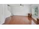 Spacious living room with hardwood floors, a staircase, and natural light at 233 Cape Harbour Loop # 107, Bradenton, FL 34212