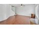 Large open living room with hardwood flooring and staircase at 233 Cape Harbour Loop # 107, Bradenton, FL 34212