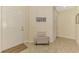 Foyer features tile flooring, a white front door, and neutral decor for a clean and inviting space at 241 Marcheno Way, Nokomis, FL 34275