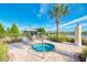 Community hot tub and lounge area overlooking lake, great for relaxing in the sun or shade at 241 Marcheno Way, Nokomis, FL 34275