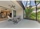 Outdoor lanai provides a relaxing space with comfortable seating and a view of lush landscaping at 241 Marcheno Way, Nokomis, FL 34275
