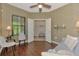 A view into a living room with hardwood floors and French doors leading to another room at 241 Marcheno Way, Nokomis, FL 34275