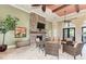 Enjoy the comfort of this lounge area, highlighted by stone fireplace and cozy seating at 241 Marcheno Way, Nokomis, FL 34275