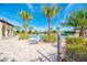Relax and soak up the sun at the community pool, surrounded by lush tropical landscaping at 241 Marcheno Way, Nokomis, FL 34275