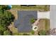 Aerial view of home's roof and brick-lined driveway, showing the surrounding trees and neighborhood layout at 2424 Affinity Ln, North Port, FL 34286