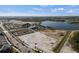 Aerial view of property, showcasing proximity to lake, community retail, and recreational areas at 2424 Affinity Ln, North Port, FL 34286