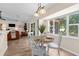 Bright dining area featuring modern lighting, sleek floors, and views to the exterior at 2424 Affinity Ln, North Port, FL 34286