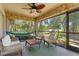Relaxing screened-in patio with comfortable seating and tropical views at 2424 Affinity Ln, North Port, FL 34286