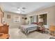 Cozy bedroom with a ceiling fan and natural light coming through the windows at 2618 Titania Rd, Englewood, FL 34224