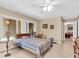 Bedroom featuring a large window, tile flooring, and neutral wall paint at 2618 Titania Rd, Englewood, FL 34224