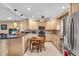 Modern kitchen featuring stainless steel appliances and a dining nook at 2618 Titania Rd, Englewood, FL 34224