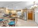 Open-concept kitchen featuring a breakfast bar, stainless steel appliances, and pendant lighting at 2618 Titania Rd, Englewood, FL 34224