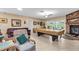 Spacious living room with tile floors, a fireplace, and an entertainment area at 2618 Titania Rd, Englewood, FL 34224