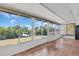 Bright sun room featuring expansive windows with views of the outdoors at 2618 Titania Rd, Englewood, FL 34224