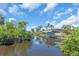 Image showing the waterway with a house featuring boat docks and lush landscaping at 2618 Titania Rd, Englewood, FL 34224