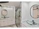 Modern bathroom with marble floors, glass vessel sink, and a glass shower with marble-style tiling at 27416 Natal Dr, Punta Gorda, FL 33983