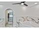 Luxurious bathroom featuring a modern tub with marble-style tiling and a glass vessel sink at 27416 Natal Dr, Punta Gorda, FL 33983