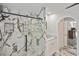 Modern bathroom showcasing a glass shower with marble-style tiling and a glass vessel sink at 27416 Natal Dr, Punta Gorda, FL 33983