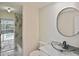 Bathroom boasts tub, modern fixtures, and access to the pool area at 27416 Natal Dr, Punta Gorda, FL 33983