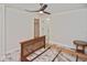 Empty bedroom with marble floors, fan, walk in closet, and open entry to an adjoining room at 27416 Natal Dr, Punta Gorda, FL 33983