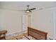 Bare bedroom featuring a ceiling fan, marble floors and an en-suite bathroom at 27416 Natal Dr, Punta Gorda, FL 33983