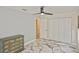 Bedroom with large closet, chest of drawers and marble-look tile floor at 27416 Natal Dr, Punta Gorda, FL 33983