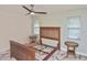Empty bedroom with two windows, marble floors and a fan at 27416 Natal Dr, Punta Gorda, FL 33983