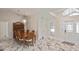 Elegant dining room with a chandelier, marble floors, and direct access to the foyer at 27416 Natal Dr, Punta Gorda, FL 33983