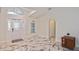 Inviting foyer features high ceilings, decorative windows, and beautiful marble flooring at 27416 Natal Dr, Punta Gorda, FL 33983