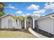 Inviting front entrance featuring a screened entryway and stylish front door, enhancing curb appeal at 27416 Natal Dr, Punta Gorda, FL 33983