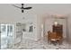 Open-concept living area with marble floors, seamlessly connecting the kitchen, dining, and living spaces at 27416 Natal Dr, Punta Gorda, FL 33983