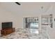 Bright living room with sliding glass doors leading to the pool area, and stunning marble floors at 27416 Natal Dr, Punta Gorda, FL 33983