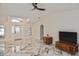 Spacious living room with vaulted ceilings, decorative windows, and marble floors at 27416 Natal Dr, Punta Gorda, FL 33983
