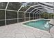 Relaxing screened-in pool area with clear water and ample space for outdoor seating and entertaining at 27416 Natal Dr, Punta Gorda, FL 33983