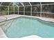 Sparkling pool enclosed by a screen offers a refreshing retreat amidst lush greenery and serene surroundings at 27416 Natal Dr, Punta Gorda, FL 33983